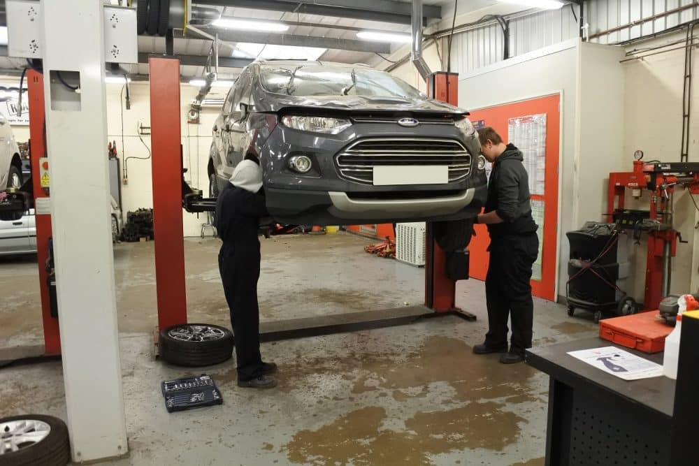 Open Road students working on a Copart vehicle